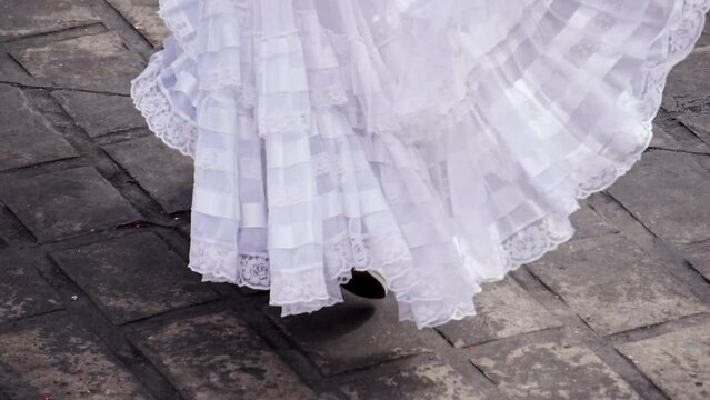 Close-up of the boots of a woman dancing a Mexican cultural folkloric dance sharing the different ethnic dances of Veracruz concept of Mexican culture.