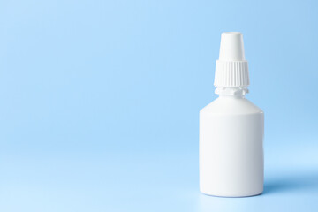 bottle syringe for injectable medication on blue background