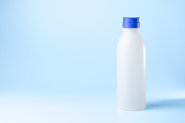 bottle syringe for injectable medication on blue background