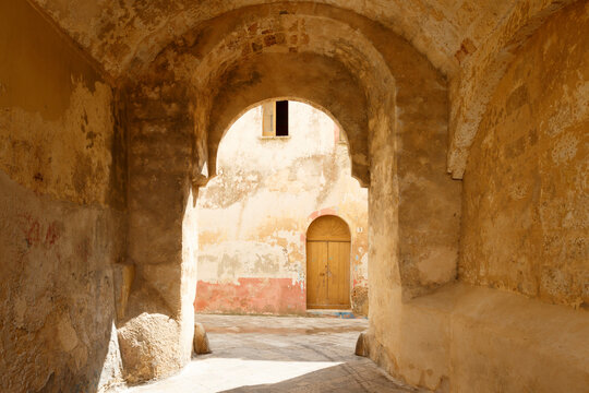 Old medieval street with arch in Ugento, Salento, Apulia, South Italy, Europe