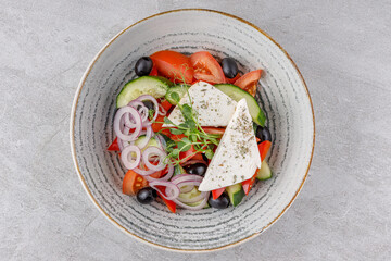 Greek salad on a stone background studio food photo 7