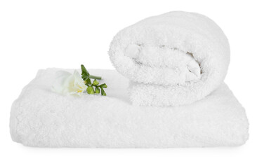 Terry towels and freesia flower isolated on white