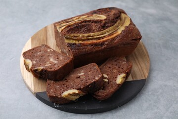 Delicious banana bread on grey table, closeup