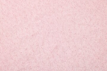 Texture of soft pink fabric as background, top view