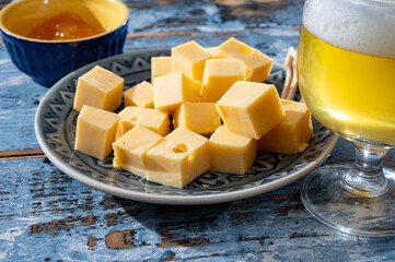 Cheese collection, Dutch ripe hard chees made from cow milk in the Netherlands in cubes and glass...