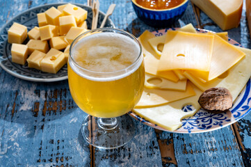 Cheese collection, Dutch ripe hard chees made from cow milk in the Netherlands in cubes and glass...