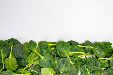 Fresh green baby Spinach leaves, diet and health concept, weight loss, spinach background top view copy space