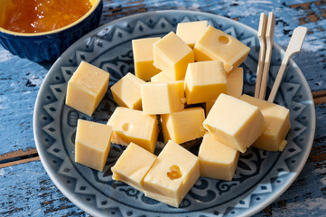 Cheese collection, Dutch ripe hard chees made from cow milk in the Netherlands in cubes and glass of beer