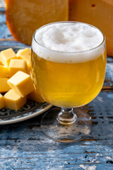 Cheese collection, Dutch ripe hard chees made from cow milk in the Netherlands in cubes and glass of beer