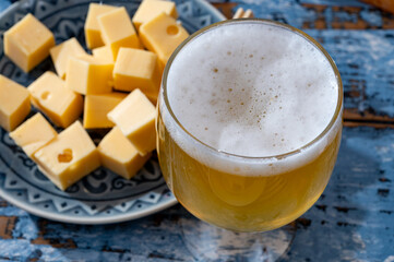 Cheese collection, Dutch ripe hard chees made from cow milk in the Netherlands in cubes and glass...