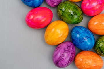 Colorful Easter eggs on table for celebration of catholic Easter in april, close up