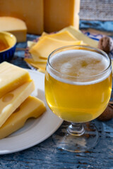 Cheese collection, Dutch ripe hard chees made from cow milk in the Netherlands in cubes and glass of beer