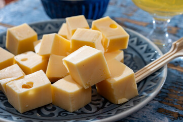 Cheese collection, Dutch ripe hard chees made from cow milk in the Netherlands in cubes and glass of beer