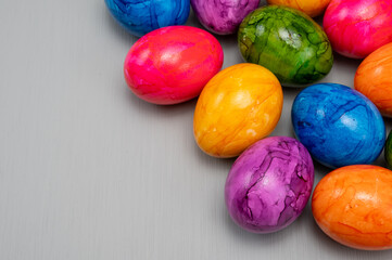Fototapeta na wymiar Colorful Easter eggs on table for celebration of catholic Easter in april, close up