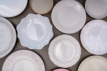 Variety of ceramic or porcelain trendy plates flat lay copy space