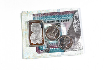 Egyptian pounds cash money with silver precious metal ounce bar of pure silver, Islamic pound...