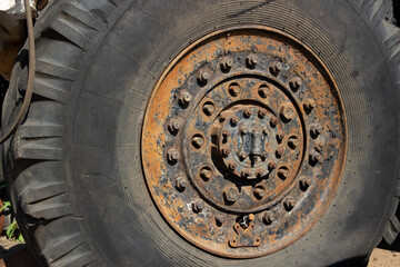 a big truck wheel with lots of fasteners