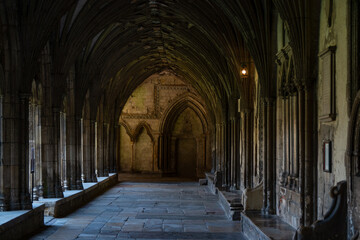 View of an empty cloister in Canterbury Cathedral under pointed Gothic arches