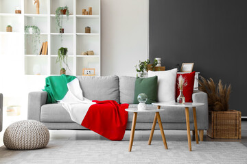 Interior of living room with Italian flag on sofa