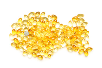 Fototapeta premium Fish shape made of capsules on white background