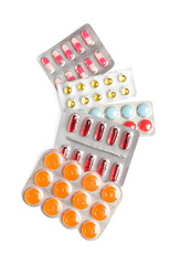 Blister packs with different pills isolated on white background