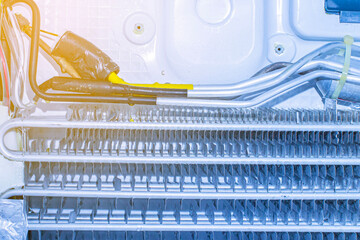 close-up of the insides of a home refrigerator during cleaning and repair service at an official...