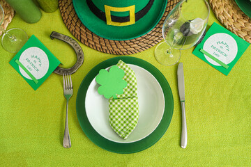 Festive table serving with leprechaun's hat and clover. St. Patrick's Day celebration