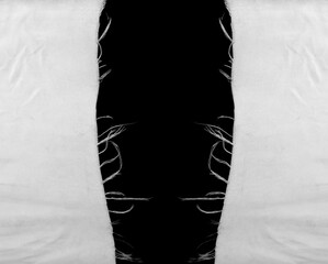 hanging teared rag spread isolated on black background , can use like a background or any texture. hole in the tissue. Unbleached beige fabric with torn stitch, hole and loose threads