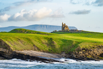 Famous Classiebawn Castle in picturesque landscape of Mullaghmore Head. Spectacular sunset view...
