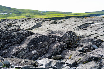 Rough and rocky shore along famous Ring of Kerry route. Rugged coast of on Iveragh Peninsula,...