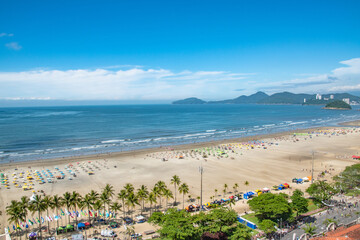 People Enjoying Large Beach on Sunny Day in Tropical Santos Sao Paolo Brazil