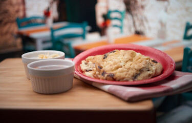 traditional Salvadoran cuisine in a colorful restaurant, featuring delicious pupusas with flavorful toppings and condiments.