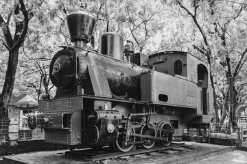 Black and white photo concept of an old steam train at the museum