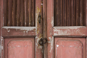 Close up of an old wooden door with knocker