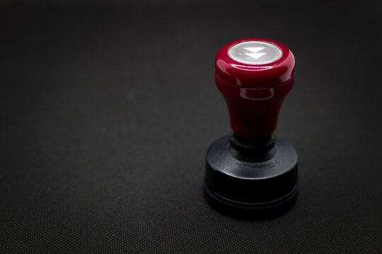 Red handle stample isolated on black background 