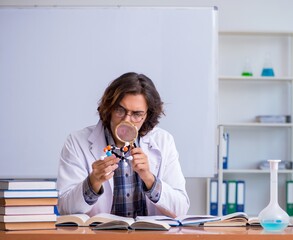 Chemistry lecturer during lecture in college