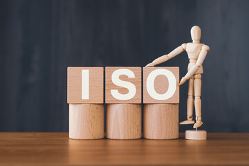 There is wood cube with the word ISO. It is an abbreviation for International Organization for Standardization as eye-catching image.