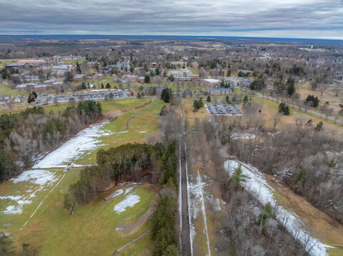 Winter aerial image of Canton, NY in St Lawrence County, on a cloudy afternoon.	