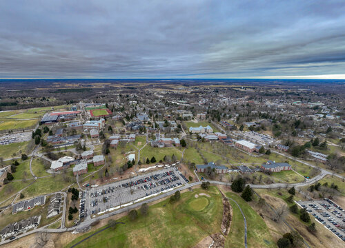 Winter aerial image of Canton, NY in St Lawrence County, on a cloudy afternoon.	