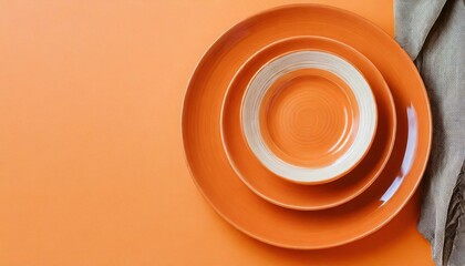 Orange plates on orange table. 