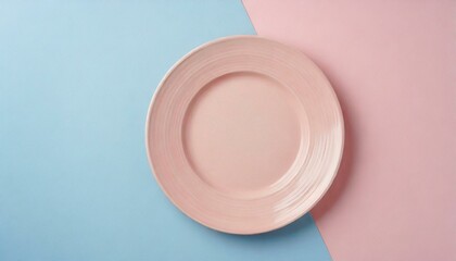 Empty pink plate on blue and pink pastel background. Top view with copy space