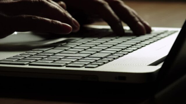 businessman hands typing on a modern laptop keyboard