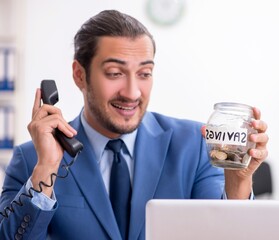 Young male businessman working in the office