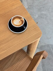 Nice Texture of Latte art on hot latte coffee . Milk foam in heart shape leaf tree on top of latte art from professional barista artist	 - 738430026