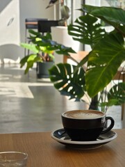 Nice Texture of Latte art on hot latte coffee . Milk foam in heart shape leaf tree on top of latte art from professional barista artist	 - 738430048