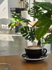 Nice Texture of Latte art on hot latte coffee . Milk foam in heart shape leaf tree on top of latte art from professional barista artist	 - 738430049