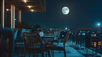 Deurstickers A lit rooftop cafe with a moonlit night sky in the background : Generative AI © Generative AI