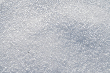 Close up backdrop from above of the sparkling white pure snow on teh ground.