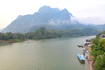 Floating raft houses and Wooden Rural huts in Laos 2022.    