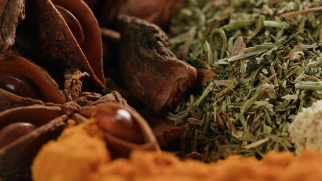 Mix spices dried pink, black pepper, green dill, red paprika, yellow turmeric, garlic, salt close-up macro. A bunch of natural spice for food .Seasonings and condiments concept